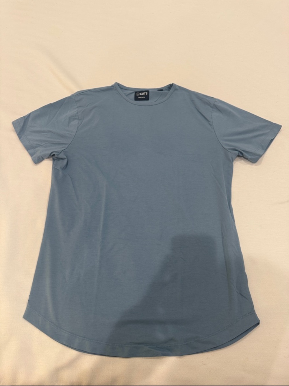 Cuts Clothing Men’s Crewneck T-Shirt in Light Blue Curved Hem